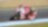 Pilote sur une superbike Ducati abordant un virage dans une course